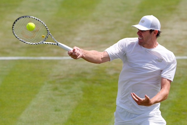 US player Reilly Opelka returns against Switzerland’s Stan Wawrinka during their men’s singles second round match on the third day of the 2019 Wimbledon Championships at The All England Lawn Tennis Club in Wimbledon, southwest London, on Wednesday  (AFP photo by Adrian Dennis)