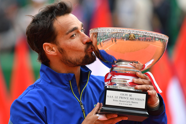 Winner Italy’s Fabio Fognini kisses the trophy after winning the final tennis match against Serbia’s Dusan Lajovic at the Monte-Carlo ATP Masters Series tournament in Monaco on Sunday (AFP photo by Yann Coatsaliou)
