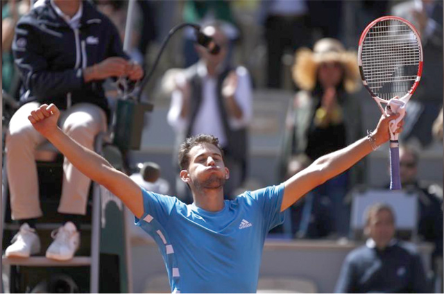 Austria’s Dominic Thiem celebrates after his semifinal match against Serbia’s Novak Djokovic at the French Open in Paris on Saturday  (Reuters photo)