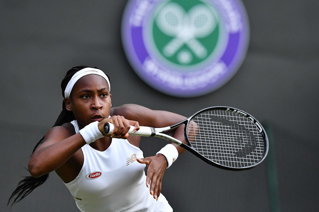 US player Cori Gauff returns the ball to US player Venus Williams during their women’s singles first round match on the first day of the 2019 Wimbledon Championships in southwest London on Monday  (AFP photo by Ben Stansall)