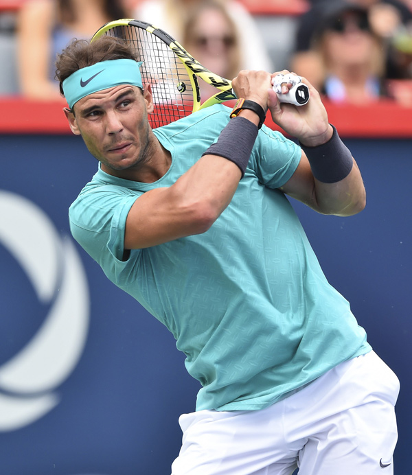 Rafael Nadal of Spain looks on after hitting a return against Daniel Evans of Great Britain during the Rogers Cup in Montreal, Canada, on Wednesday  (AFP photo by Minas Panagiotakis)