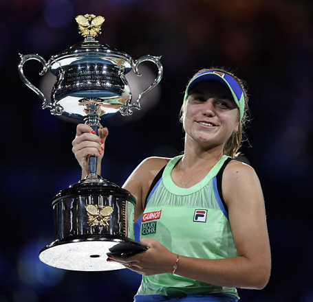 Sofia Kenin of the US poses with the trophy after beating Spain’s Garbine Muguruza in their women’s singles final match at the Australian Open in Melbourne on Saturday  (AFP photo by Saeed Khan)