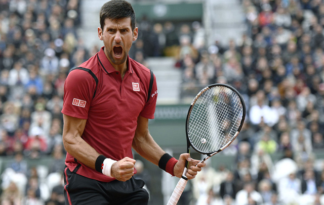 Serbia’s Novak Djokovic celebrates after winning his men’s semifinal match against Austria’s Dominic Thiem at the Roland Garros 2016 French Tennis Open in Paris on June 3 (AFP photo by  Martin Bureau)