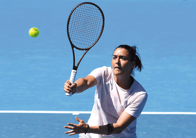 Tunisia’s Ons Jabeur hits a return during a practice session on Saturday in Melbourne ahead of the Australian Open tournament (AFP photo by Paul Crock)