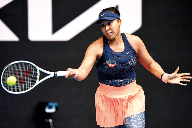 Japan’s Naomi Osaka hits a return against Russia’s Anastasia Pavlyuchenkova during their women’s singles match at the Australian Open tournament in Melbourne on Monday  (AFP photo by William West)