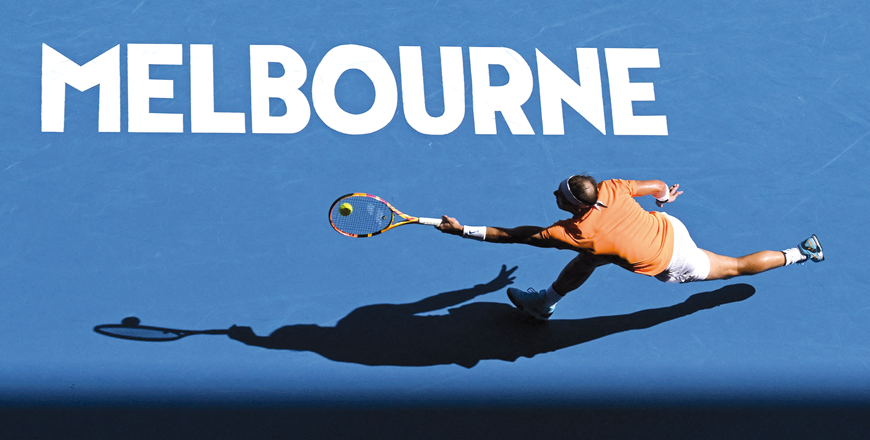 Spain’s Rafael Nadal hits a return against Britain’s Jack Draper during their men’s singles match at the Australian Open in Melbourne on Monday (AFP photo by Manan Vatsyayana)