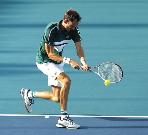Daniil Medvedev of Russia returns a shot to Frances Tiafoe of the United States during the Miami Open in Miami Gardens, Florida, on Tuesday  (AFP photo by Michael Reaves)