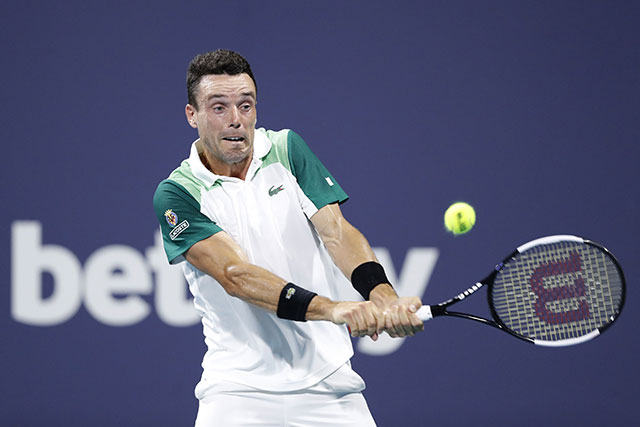 Roberto Bautista Agut of Spain returns a shot to Daniil Medvedev of Russia in their quarterfinal match at the Miami Open in Miami Gardens, Florida, on Wednesday (AFP photo by Michael Reaves)