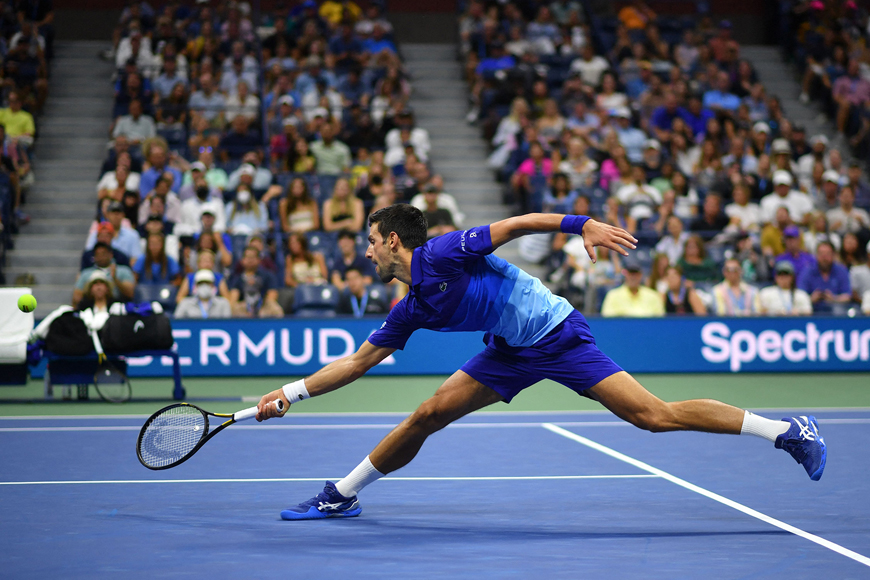 Serbia’s Novak Djokovic hits a return to US player Jenson Brooksby during their 2021 US Open tournament men’s singles fourth round match in New York City on Monday  (AFP photo by Ed Jones)
