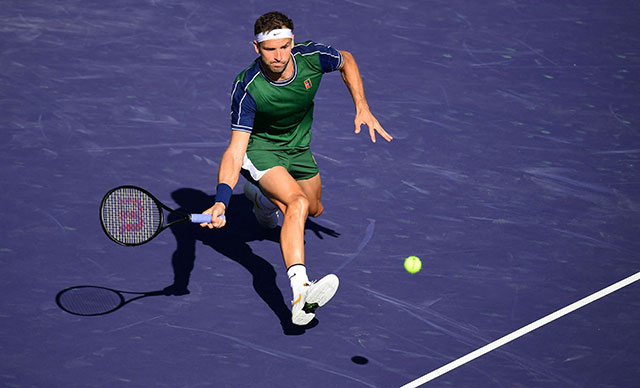 Grigor Dimitrov of Bulgaria reacts for a forehand return to Daniil Medvedev of Russia in their Round of 16 match at the ATP/WTA Indian Wells tournament in Indian Wells, California, on Wednesday (AFP photo by Frederic J. Brown)
