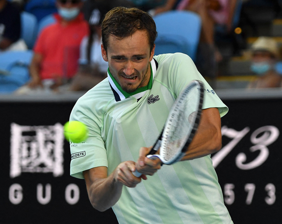 Russia’s Daniil Medvedev hits a return against Netherlands’ Botic Van de Zandschulp during their men’s singles match at the Australian Open in Melbourne on Saturday  (AFP photo by Paul Crock)