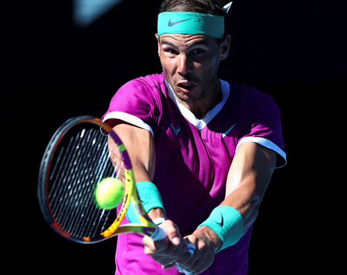 Spain’s Rafael Nadal hits a return against France’s Adrian Mannarino during their men’s singles match at the Australian Open in Melbourne on Sunday   (AFP photo by Aaron Francis)