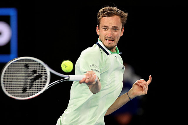 Russia's Daniil Medvedev hits a return against Canada's Felix Auger-Aliassime during their men's singles quarter-final match at the Australian Open in Melbourne on Wednesday (AFP photo by Martin Keep)