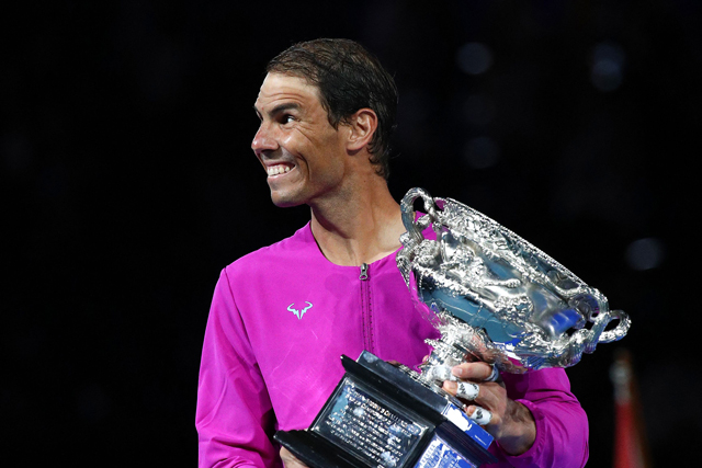 Spain’s Rafael Nadal holds the trophy after beating Russia’s Daniil Medvedev in their men’s singles final match of the Australian Open in Melbourne on Sunday (AFP photo by Aaron Francis)