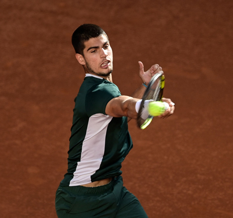 Spain’s Carlos Alcaraz returns the ball to Germany’s Alexander Zverev during their 2022 ATP Tour Madrid Open men’s singles final match in Madrid on Sunday (AFP photo by Javier Soriano)