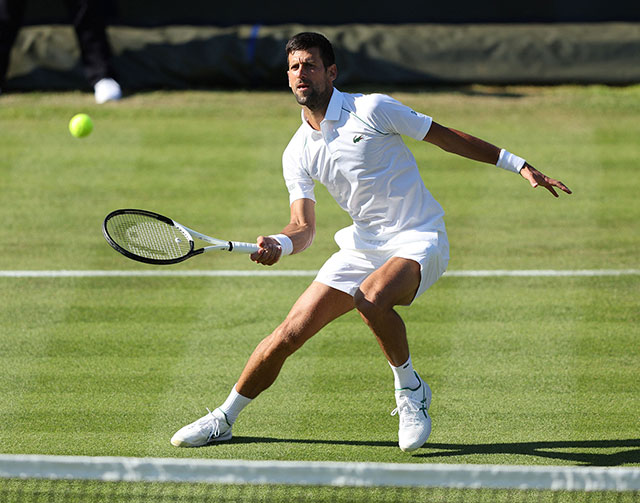 Serbia’s Novak Djokovic returns to Canada’s Felix Auger-Aliassime during their men’s exhibition match at The Giorgio Armani Tennis Classic tournament in London on Wednesday  (AFP photo by Adrian Dennis)