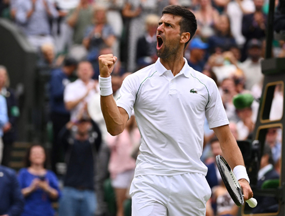 Serbia’s Novak Djokovic celebrates winning against Italy’s Jannik Sinner after their men’s singles quarter final match at the 2022 Wimbledon Championships in London on Tuesday (AFP photo by Sebastien Bozon)