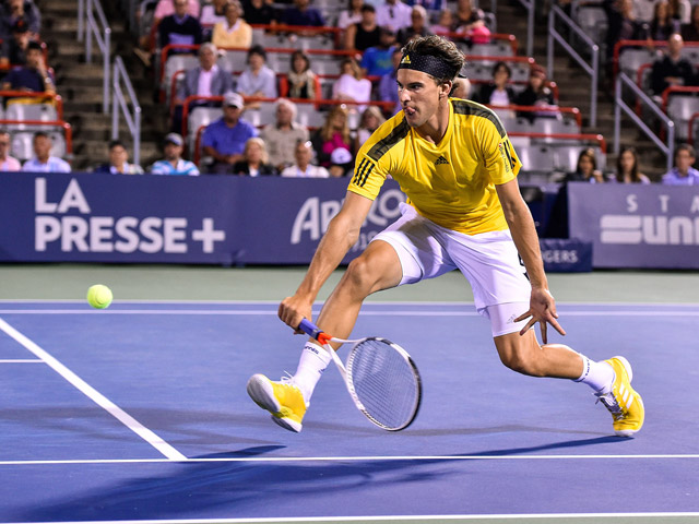 Dominic Thiem of Austria hits a return shot against Diego Schwartzman of Argentina at the Rogers Cup on Tuesday in Montreal, Quebec, Canada  (AFP photo by Minas Panagiotakis)