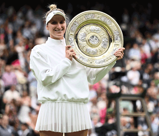 Czech Republic’s Marketa Vondrousova celebrates with the trophy after winning the women’s singles final match against Tunisia’s Ons Jabeur at the 2023 Wimbledon Championships in London on Saturday (AFP photo by Sebastien Bozon)
