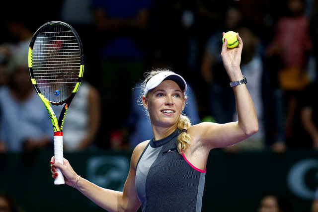 Denmark’s Caroline Wozniacki celebrates winning her semifinal match against Czech Republic’s Karolina Pliskova at the WTA Finals in Singapore on Saturday (Reuters photo by Edgar Su)