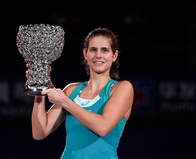 Julia Goerges of Germany celebrates with the trophy after her victory against Coco Vandeweghe of the US in the women’s singles final at the WTA Elite Trophy tournament in Zhuhai, China, on Sunday (AFP photo)