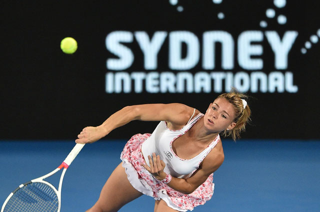 Camila Giorgi of Italy serves to Agnieszka Radwanska from Poland in their women’s singles quarter-final match at the Sydney International tournament in Sydney on Thursday  (AFP photo by Peter Parks)