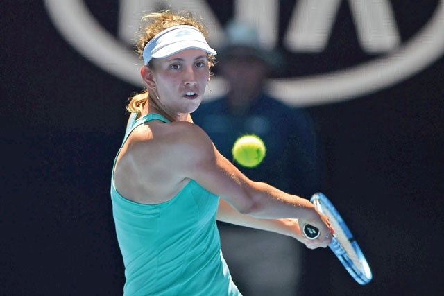 Belgium’s Elise Mertens hits a return against Ukraine’s Elina Svitolina during their women’s singles quarter-finals match on day nine of the Australian Open tournament in Melbourne on Tuesday (AFP photo by Peter Parks)