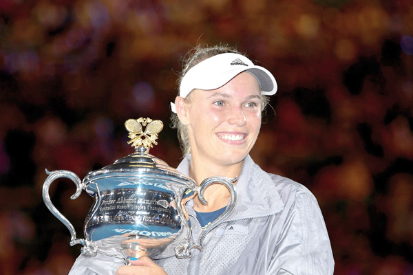 Denmark’s Caroline Wozniacki celebrates after her victory over Romania’s Simona Halep in the women’s singles final on day 13 of the Australian Open tournament in Melbourne on Saturday  (AFP photo by Saeed Khan)