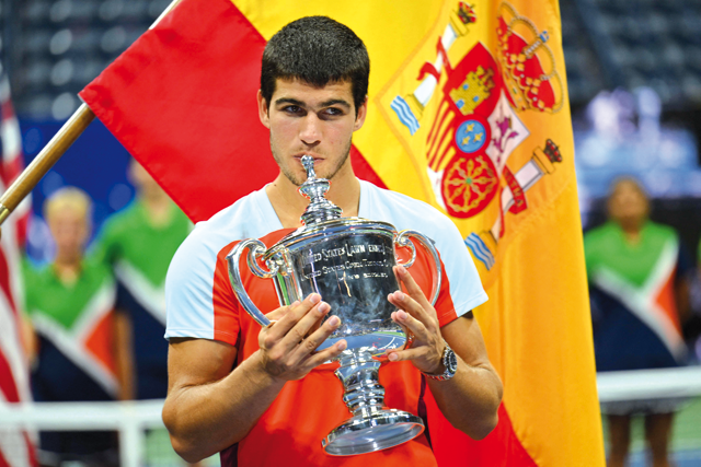 Spain’s Carlos Alcaraz celebrates with the trophy after winning against Norway’s Casper Ruud during their 2022 US Open men’s singles final match in New York on Sunday (AFP photo by Angela Weiss)