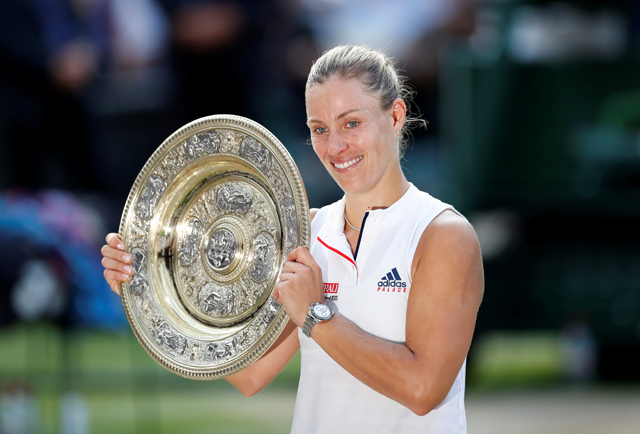Germany’s Angelique Kerber celebrates winning the women’s singles final with the Wimbledon trophy at the All England Lawn Tennis and Croquet Club, in London, on Saturday (Reuters photo by Andrew Boyers)