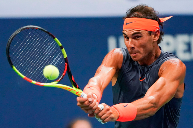 Spain’s Rafael Nadal hits a return to Austria’s Dominic Thiem during their men’s singles quarter-finals match at the 2018 US Open in New York City on Tuesday  (AFP photo by Eduardo Munoz Alvarez)