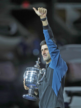 Serbia’s Novak Djokovic holds the winners’ trophy after beating Argentina’s Juan Martin del Potro in the  Men’s Singles Finals match at the 2018 US Open in New York City on Sunday   (AFP photo by Eduardo Munoz Alvarez)