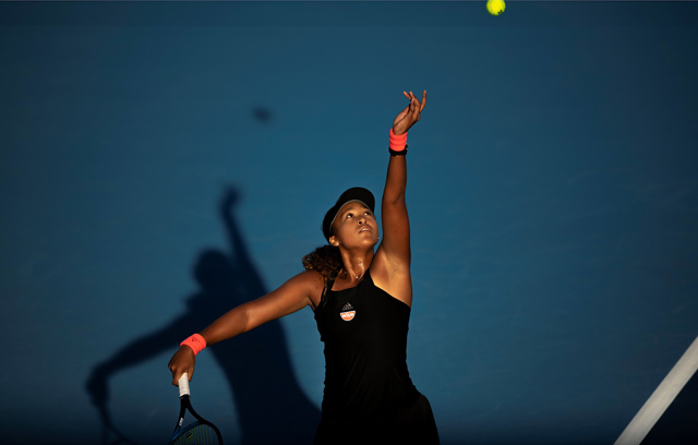 Naomi Osaka of Japan serves during her women’s singles second round match against Danielle Collins of the US at the China Open tennis tournament in Beijing on Tuesday (AFP photo by Fred Dufour)