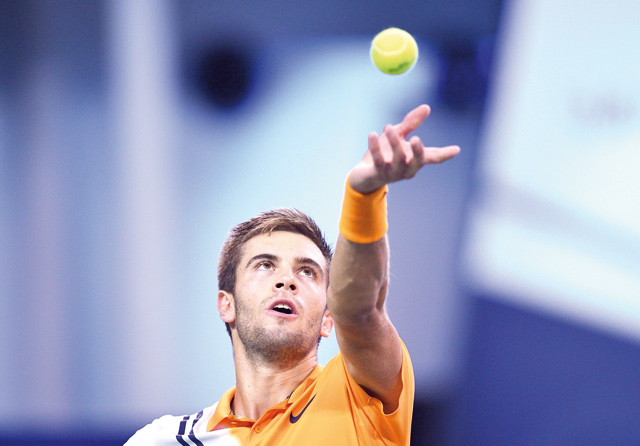 Borna Coric of Croatia serves against Roger Federer of Switzerland in their men’s singles semifinal match at the Shanghai Masters tournament on Saturday  (AFP photo)