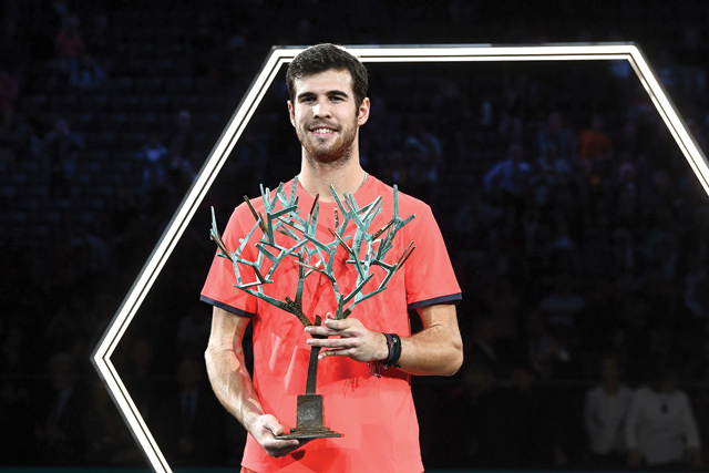 Russia’s Karen Khachanov poses with the trophy after beating Serbia’s Novak Djokovic in the men’s singles final match at the Paris Masters in Paris on Sunday (AFP photo by Anne-Christine Poujoulat)