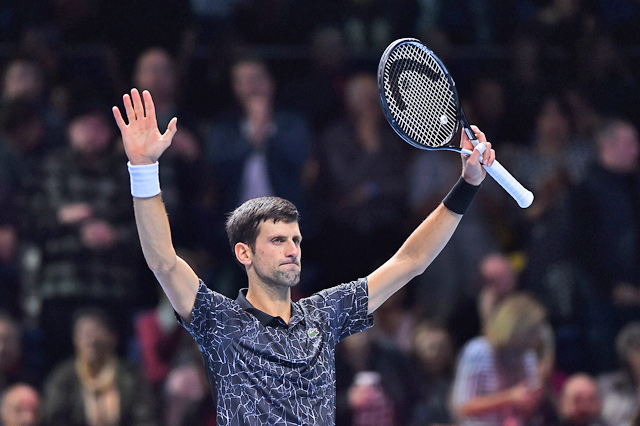 Serbia’s Novak Djokovic celebrates beating Germany’s Alexander Zverev at the ATP Finals in London on Wednesday  (AFP photo by Glyn Kirk)