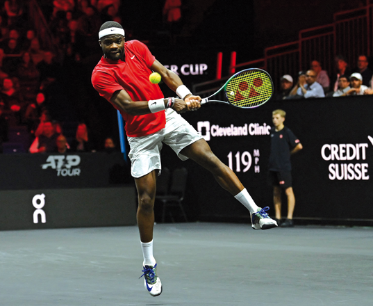 USA’s Frances Tiafoe of Team World returns the ball to Greece’s Stefanos Tsitsipas of Team Europe during their 2022 Laver Cup men’s singles match in London on Sunday (AFP photo by Glyn Kirk)