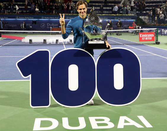 Switzerland’s Roger Federer celebrates with the trophy after winning the final match at the ATP Dubai Tennis Championship in Dubai on Saturday  (AFP photo by Karim Sahib)