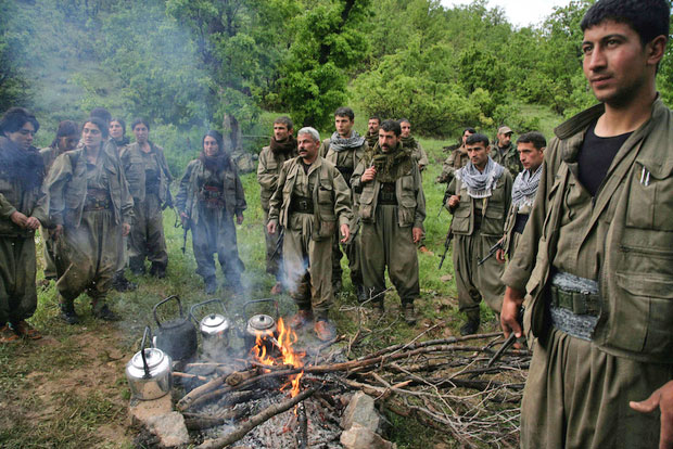 Kurdistan Workers' Party fighters greet their comrades as they arrive in the northern Iraqi city of Dohuk (AFP photo)