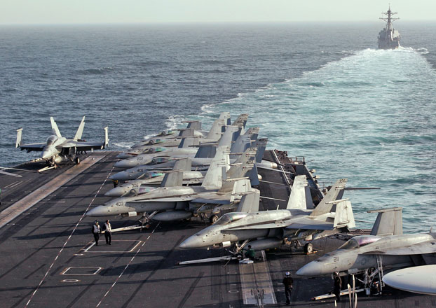 The Sterett Destroyer escorts the Nimitz-class aircraft carrier USS Abraham Lincoln (CVN 72) during a transit through the Strait of Hormuz, on February 14, 2012 (REUTERS File Photo)