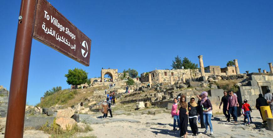 Tourists walking around the ruins of the ancient city of Gadara in Umm Qais, some 35km northwest of Irbid. According to the Jordan Society of Travel Agents, some 84 Jordanian travel agencies closed in 2018 (JT file photo)