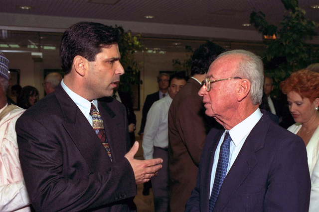 Former Israeli prime minister Yitzhak Rabin speaks with former energy minister, Gonen Segev, during a conference in Jerusalem, in this file photo released by the Israeli Government Press Office, on Monday (Reuters photo)