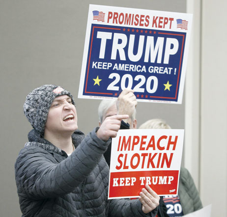 A protestor shouts at US Congresswoman Elissa Slotkin (D-MI) at a Town Hall meeting where she was discussing her decision to vote in favour of the impeachment of President Donald Trump to her constituents on Monday in Rochester, Michigan (AFP photo)