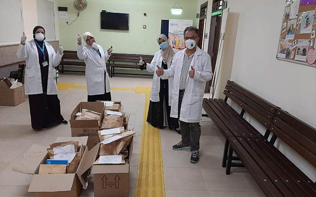 UNRWA staff at the Aqaba Health Centre distribute medication for Palestinian refugees with non-communicable diseases in this recent photo (Photo courtesy of UNRWA Facebook page)
