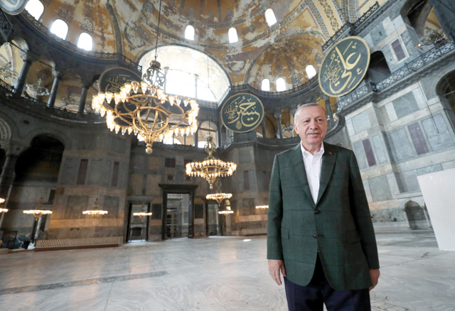 This handout photo released by the Turkish Presidential press office shows Turkish President Recep Tayyip Erdogan visiting the Hagia Sofia or Ayasofya-i Kebir Camii in Istanbul, on Sunday (AFP photo)