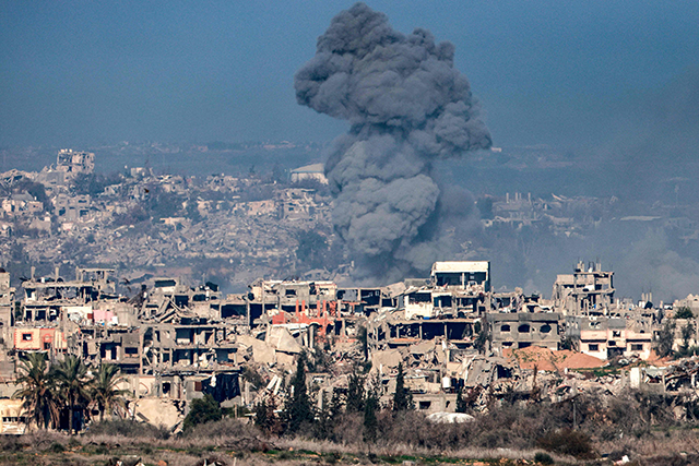This picture taken from the Israeli side of the border with the Gaza Strip shows a smoke plume rising from explosions above destroyed buildings in the northern Gaza Strip on January 13, 2025 amid the ongoing Israeli war of aggression against the Palestinian territory (AFP photo)