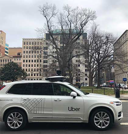 An Uber car equipped with cameras and sensors drives the streets of Washington, DC, on January 24 (AFP photo)