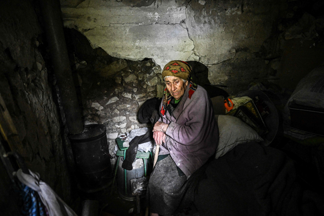 Nina Gonchar sits on a bed inside a bunker in Bohorodychne village in Kramatorsk, Donetsk region, on Tuesday, amid the Russian military operations of Ukraine (AFP photo)