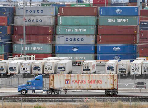 In this file photo taken on May 10, unloaded containers from Asia are seen at the main port terminal in Long Beach, California   (AFP photo)