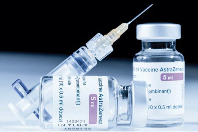 This photo shows vials of the AstraZeneca COVID-19 vaccine and a syringe in Paris on March 11, 2021 (AFP photo)